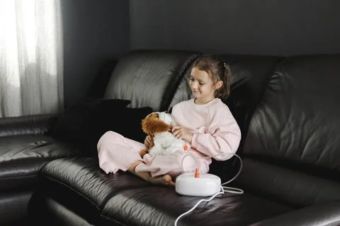 Child smiling while receiving asthma or cold treatment Stock Photos