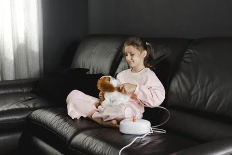 Child smiling while receiving asthma or cold treatment Stock Photos