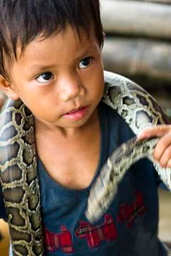 Child snake performer Stock Photos