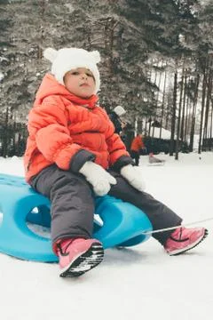 Child on the snow Stock Photos