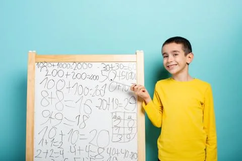 Child solves mathematical problem with abacus. Cyan background Stock Photos