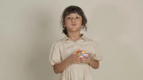 Child Solving a Rubik's Cube Stock Footage 281359539