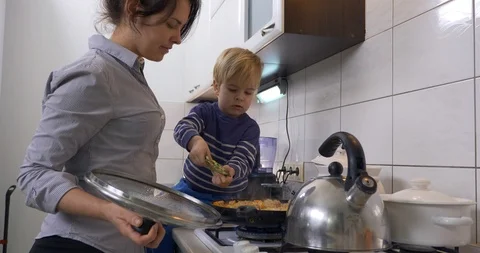 Child Son Helps Mother Cooking Food Meal... | Stock Video | Pond5