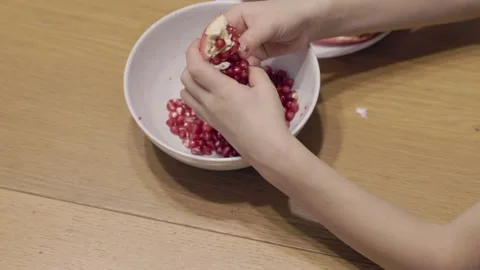 Child Sorting Pomegranate Seeds Concept of Coordination Stock Footage 321892626