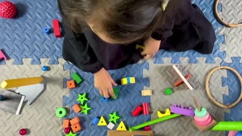 Child with Special Needs Engaging in Occupational Therapy Play Stock Footage 328986131