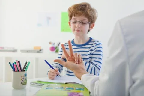 Child in speech therapy Stock Photos