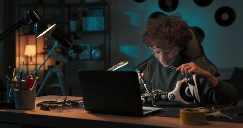 Child spends time at desk in room watching instructional videos on laptop Stock Footage 200875266