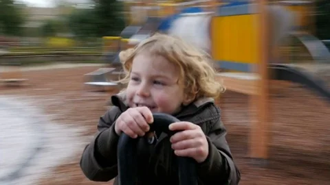 Child spin on carousel time-lapse Stock Footage 80021012