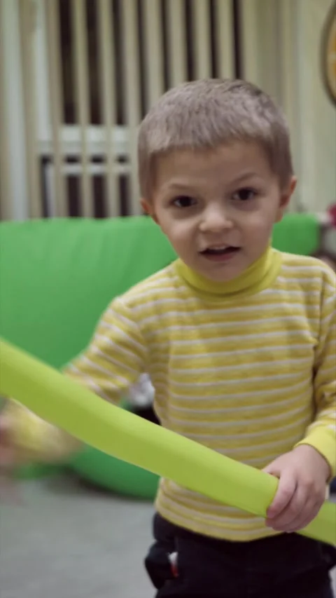 Child spinning with balloon on camera. child playing with inflatable balloon Stock Footage 296195199