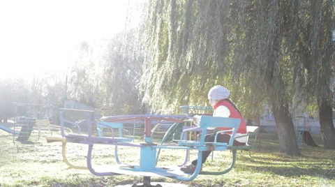 Child spinning on a carousel Video stock 32107963
