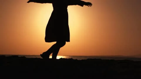 Child spinning at dawn Stock Footage 20156166