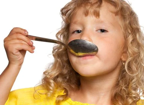 Child with spoon Stock Photos