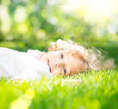 Child in spring park Stock Photos