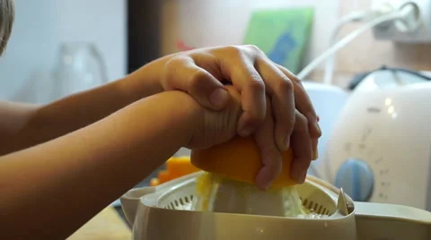 Child squeezes orange juice Stock Footage 56256148