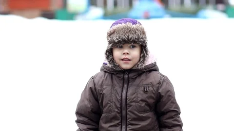 Child standing and looking from side to side Stock Footage 123533702