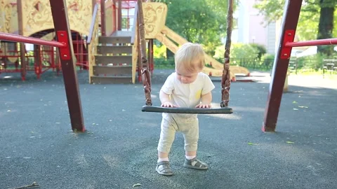 The child is standing next to the wheel Stock Footage 133632096
