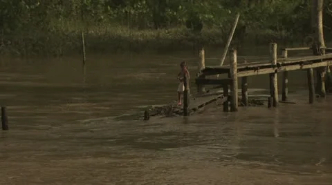 Child Standing on A Pier On The Amazon River 스톡 동영상 19036660