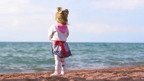 The child stands by the sea Stock Footage 99130631