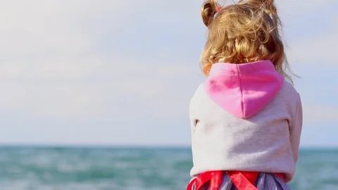 The child stands by the sea Stock Footage 99436855