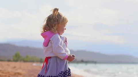 The child stands by the sea Video stock 99437091