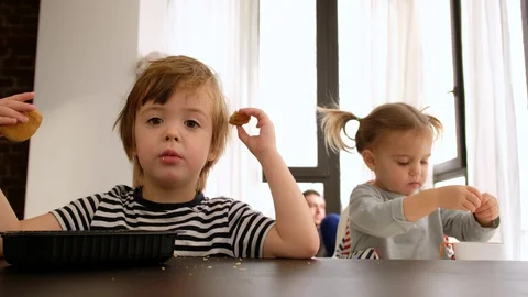 Child stared at the camera while having breakfast Video stock 129655367