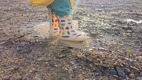 Child Stepping Beside Puddle In Sunlight Stock Footage 339999059