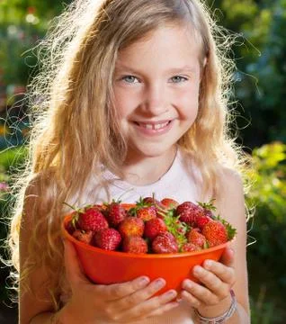 Child with strawberry Stock Photos