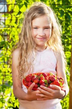 Child with strawberry Stock Photos