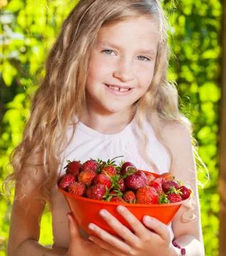 Child with strawberry Stock Photos