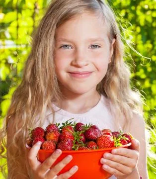 Child with strawberry Stock Photos