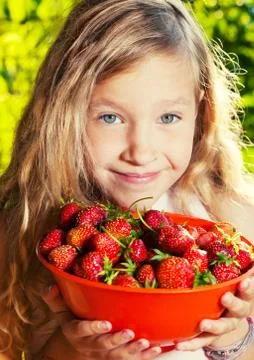 Child with strawberry Stock Photos