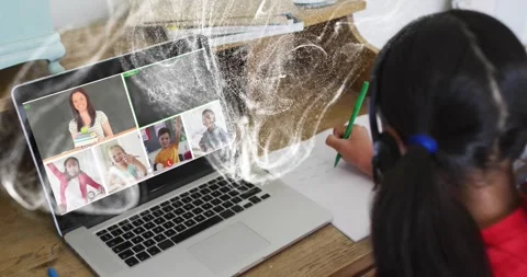 Child student taking notes with green pencil during online class, overlay Stockbeeldmateriaal 331571039