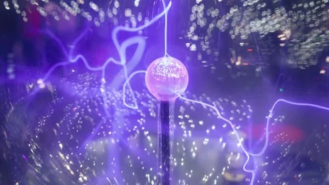 A child studies an exhibit in a museum, a ball with plasma and lightning Stock Footage 270181221