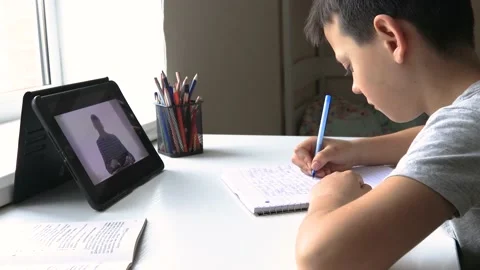 The child studies remotely at school. back to school Stock Footage