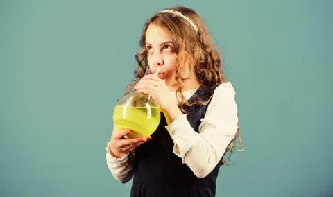 Child study bilogy lesson. small girl scientist with testing flask. education 스톡 사진