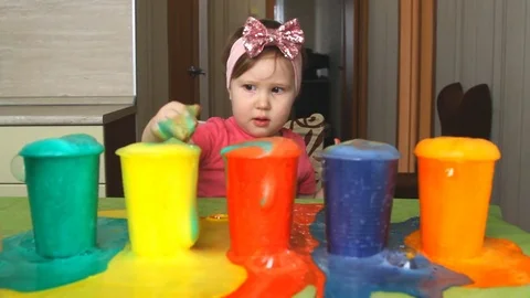 The child is studying colors. Stock Footage 74693913