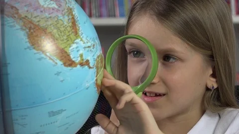 Child Studying Earth Globe, Kid in School Class Girl Learning, Student Library Stock Footage 84889328