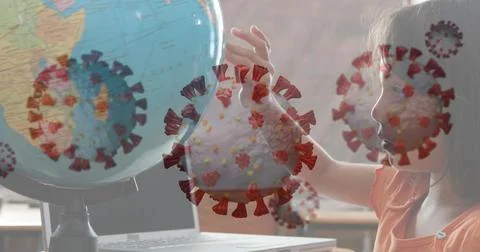 Child studying globe at home, learning about coronavirus impact on world 写真素材