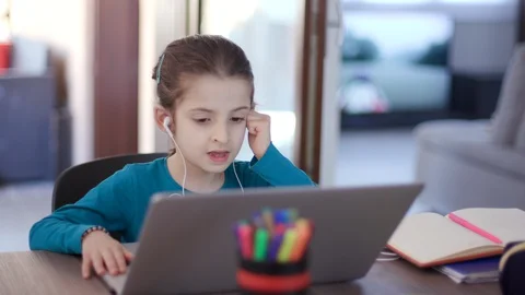 Child Studying At Home Remote Learning With Computer During Covid-19 Quarantine Video stock 128922857