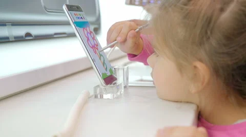 The Child is Studying Modern Technology Draws on the Screen Keeps Hands Stylus Stock Footage 68386597
