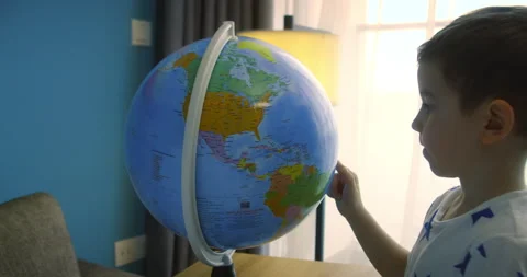Child is studying while sitting at home in rays of sun in room. Portrait child Stock Footage 220736702