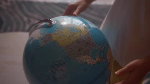 Child studying world map on globe pointing finger at Canada country Stock Footage 343550166
