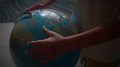 Child studying world map on globe pointing finger at Canada country Stock Footage 346312941