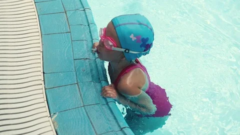 Child swimmer in the pool Stock Footage 76113301