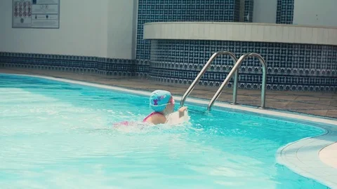 Child swimmer in the pool Stock Footage 76113580