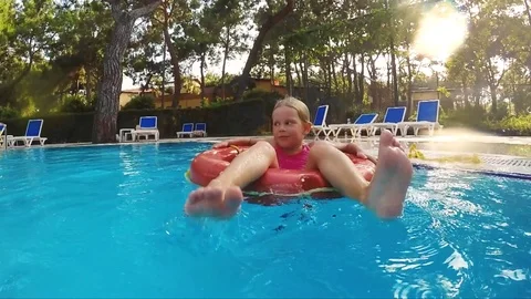 Child swimming in circle Stock Footage 81504384