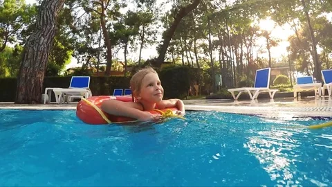 Child swimming in circle Video stock 81504486