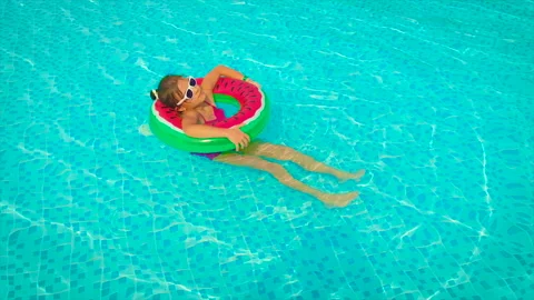The child swims in the pool. Selective focus. Stock Footage 157045690