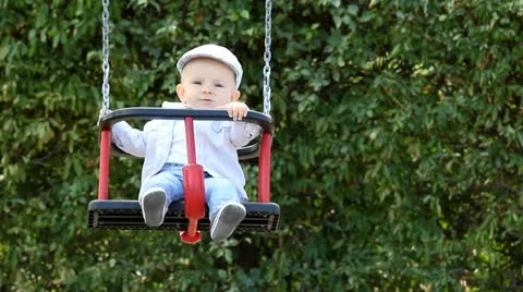 Child in a swing Stock Footage 12300531