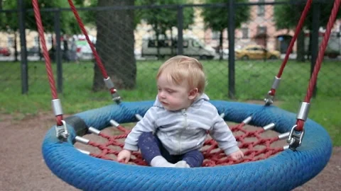 Child on a swing Stock Footage 134256773
